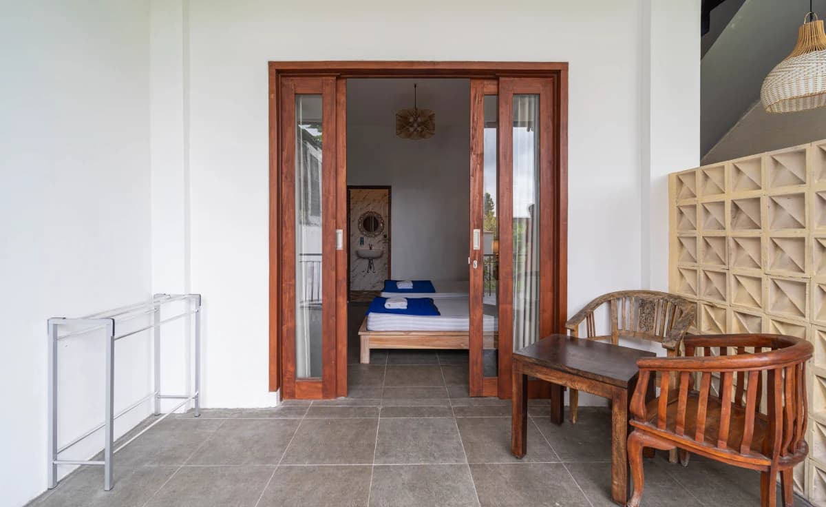 Clean student accommodation room with comfortable bedding in Bali