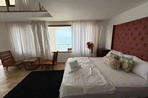 Bright private accommodation room for yoga students in Kerala