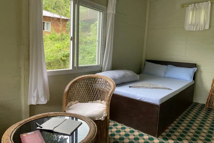 Clean student accommodation room with comfortable bedding in Nepal