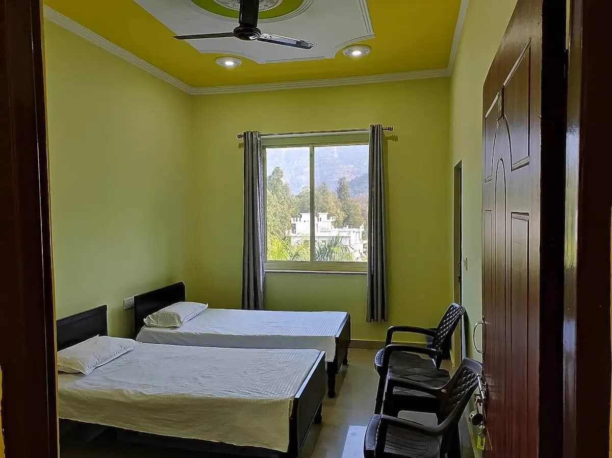 Neat and spacious yoga retreat accommodation room